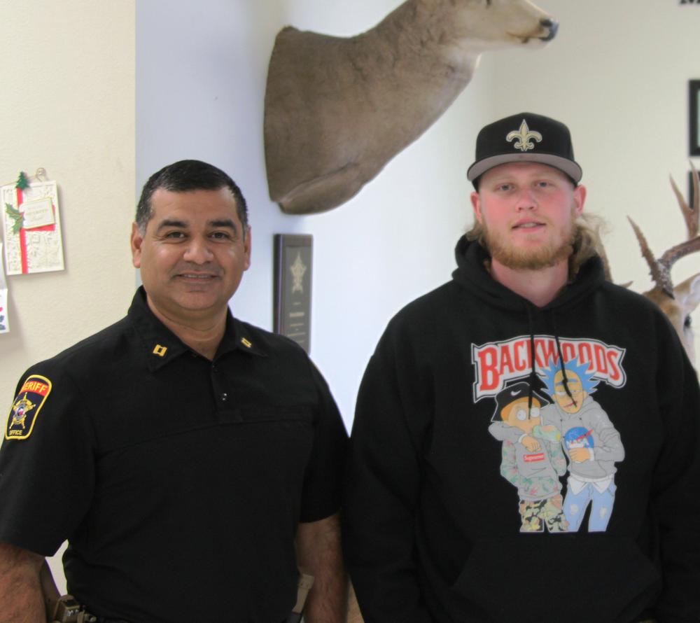 A smiling Capt Mendoza and James Lilley standing in the MCSO Lobby for Life Saving award and recognition.JPG